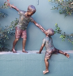 Helping hands - boys climbing