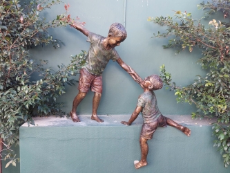Helping hands - Boys climbing 